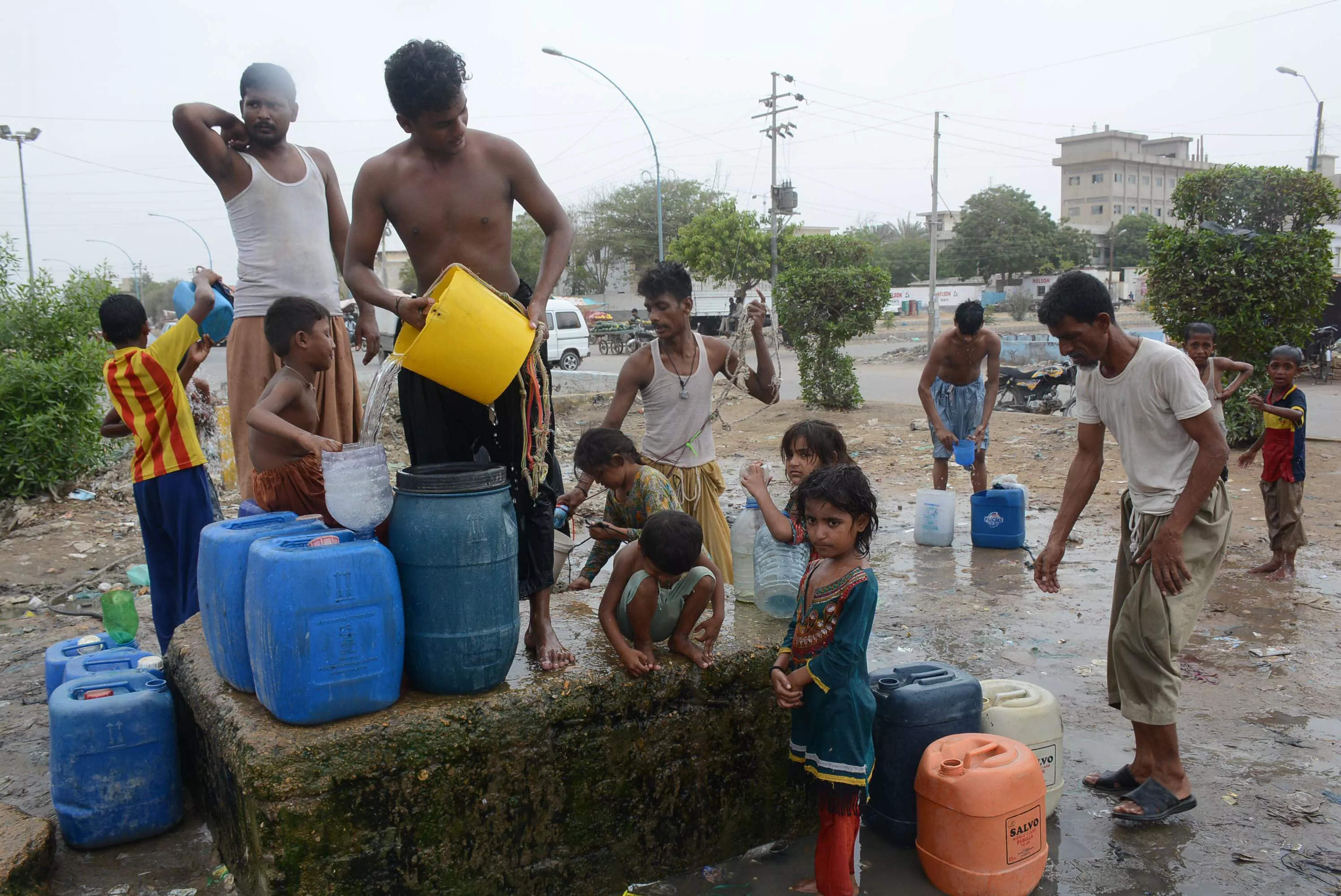 people filling their containers with water near korangi due to the shortage of water the judicial commission was formed to investigate lack of water supply and poor sanitation conditions in sindh photo file people filling their containers with water near korangi due to the shortage of water the judicial commission was formed to investigate lack of water supply and poor sanitation conditions in sindh photo file