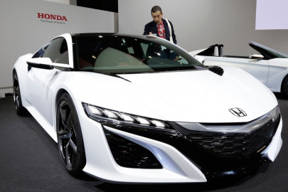 honda to focus on self driving cars robotics evs through 2030