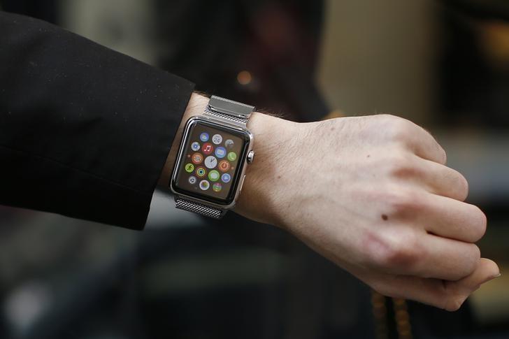 a customer presents his apple watch after buying it at a store in paris france april 24 2015 photo reuters