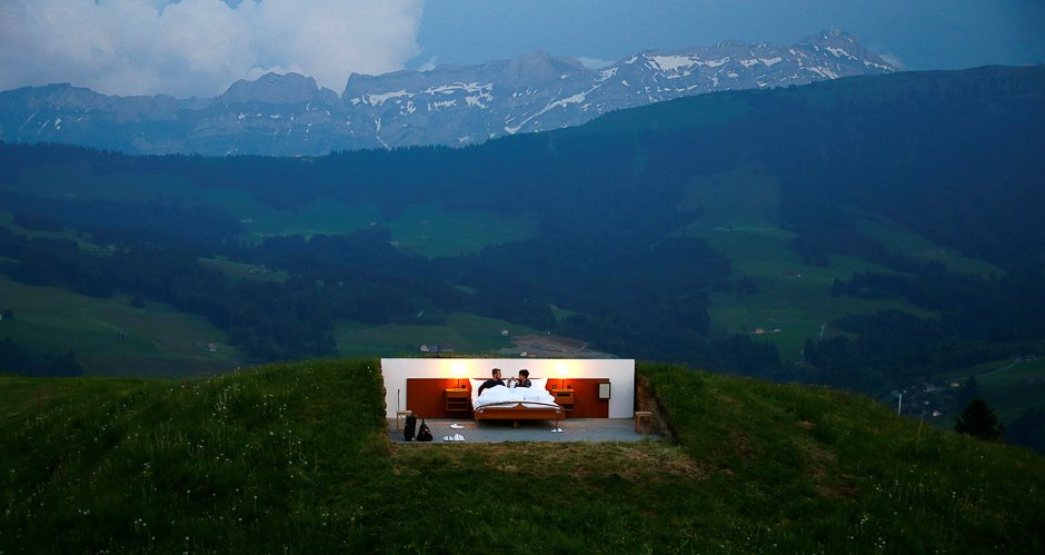 raphael and mirjam r pose as first guests in the bedroom of the null stern hotel zero star hotel land art installation by swiss artists frank and patrik riklin on an alp mount saentis near gonten switzerland photo reuters