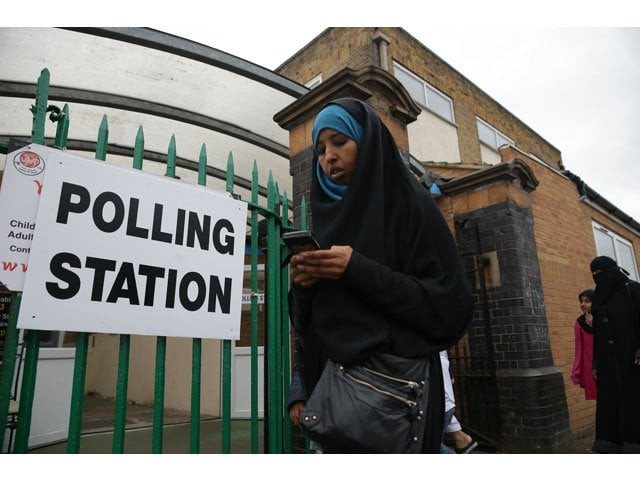 a muslim woman walks past a polling station set up at the muslim community centre in ilford east london on june 8 2017 as britain holds a general election photo afp a muslim woman walks past a polling station set up at the muslim community centre in ilford east london on june 8 2017 as britain holds a general election photo afp