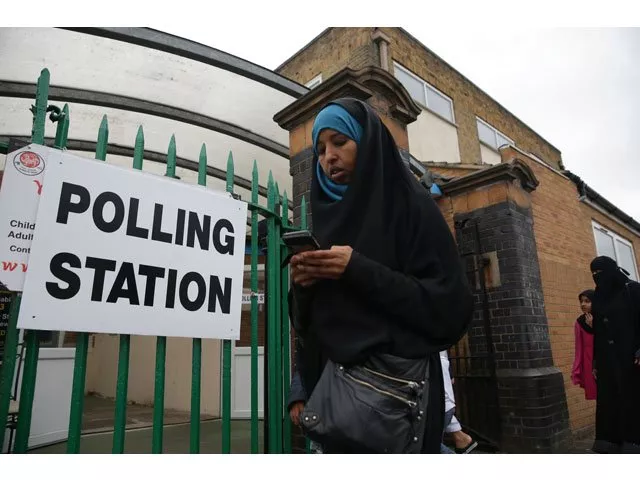 a muslim woman walks past a polling station set up at the muslim community centre in ilford east london on june 8 2017 as britain holds a general election photo afp a muslim woman walks past a polling station set up at the muslim community centre in ilford east london on june 8 2017 as britain holds a general election photo afp