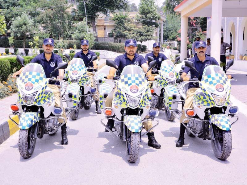 tourist police on their motorbikes photo express