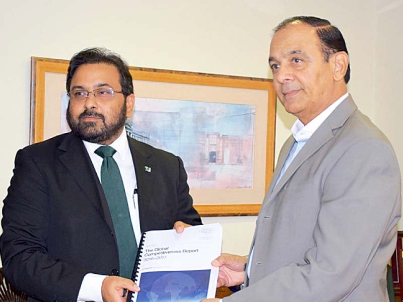 representative of world economic forum presents annual report of the forum to nab chairman qamar zaman chaudhry photo express