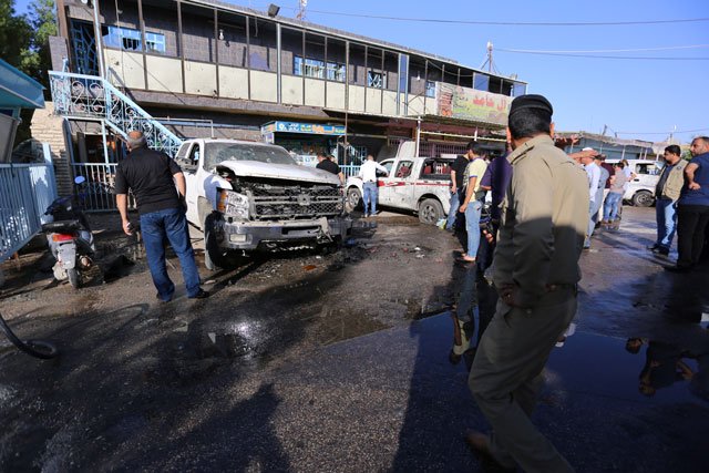 iraqi security forces gather at the site of a bomb attack in the city of kerbala iraq june 9 2017 photo reuters