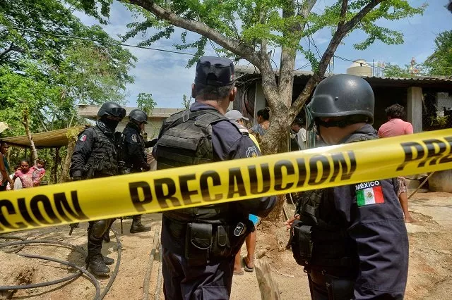 police remain outside the house where were six people including a four month old baby were killed by gunmen in san pedro cacahuatepec acapulco municipality guerrero state mexico on june 9 2017 photo afp police remain outside the house where were six people including a four month old baby were killed by gunmen in san pedro cacahuatepec acapulco municipality guerrero state mexico on june 9 2017 photo afp