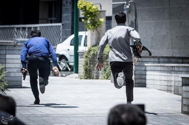 members of iranian forces run during an attack on the iranian parliament in central tehran iran june 7 2017 photo reuters members of iranian forces run during an attack on the iranian parliament in central tehran iran june 7 2017 photo reuters