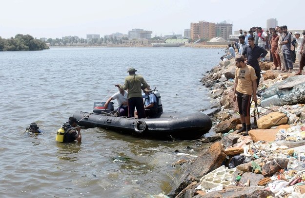 rescuers search for the bodies of two teenagers in the waters of mai kolachi creek in karachi on sunday june 11 2017 photo nni
