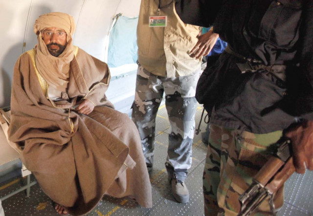 saif al islam qaddafi is pictured sitting in a plane in zintan photo reuters saif al islam qaddafi is pictured sitting in a plane in zintan photo reuters