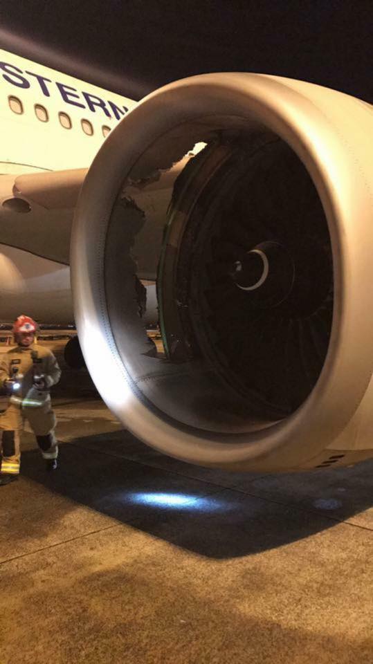 image of the gaping hole in the casing of one of the plane 039 s engines photo twitter