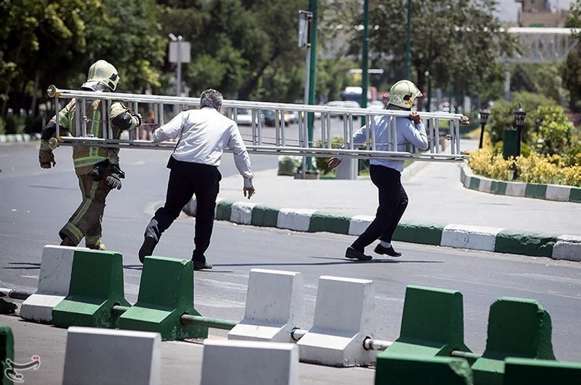 members of iranian civil defence run during an attack on the iranian parliament in central tehran iran june 7 2017 photo reuters