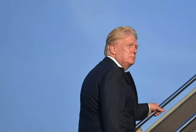 us president donald trump makes his way to board air force one before departing from newark liberty airport in newark new jersey on june 11 2017 photo afp us president donald trump makes his way to board air force one before departing from newark liberty airport in newark new jersey on june 11 2017 photo afp