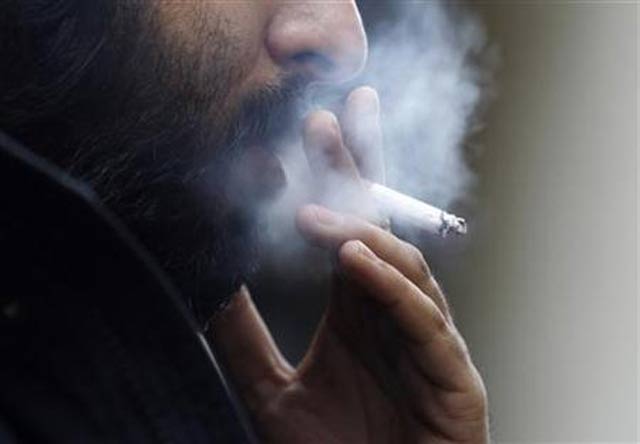 a man smokes a cigarette in central london february 1 2010 photo reuters