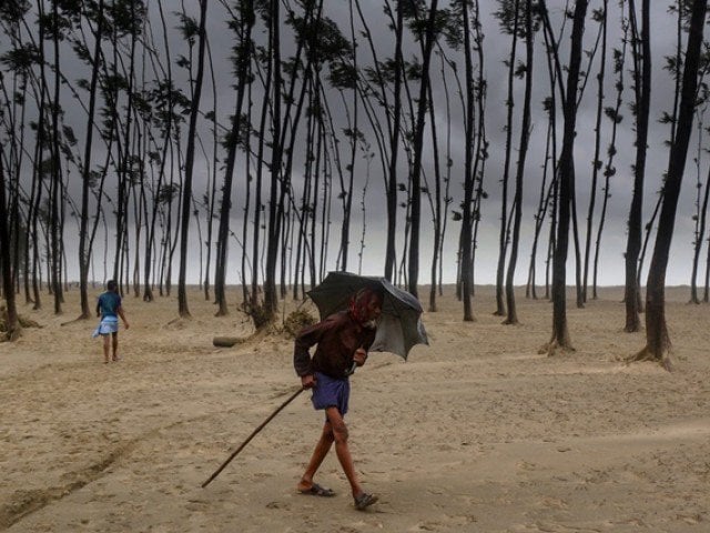 bangladeshi villager evacuates to a cyclone shelter on the coast in cox 039 s bazar district photo afp