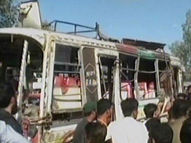 people gather around a bus which overturned on karachi 039 s university road screen grab