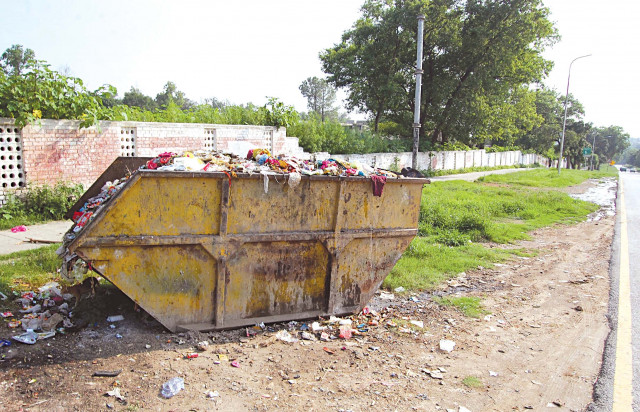 while cda campaigns to get people to not litter its own garbage collection points set up near educational institutions residential areas greenbelts and mosques do not present a pretty sight photo muhammad javaid while cda campaigns to get people to not litter its own garbage collection points set up near educational institutions residential areas greenbelts and mosques do not present a pretty sight photo muhammad javaid