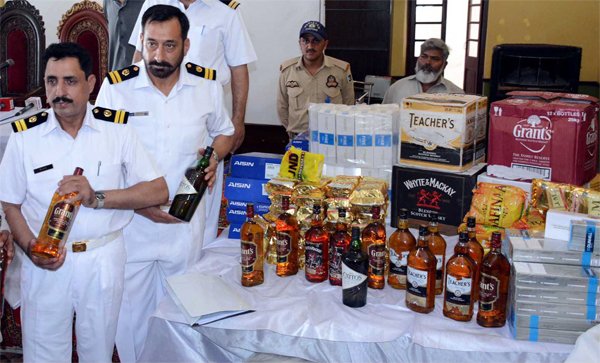 customs officials showing seized liquor in a press conference photo ppi customs officials showing seized liquor in a press conference photo ppi