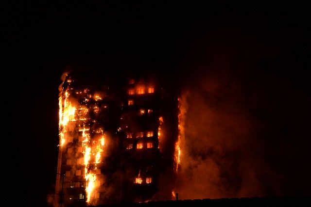 this handout image received by local resident giulio thuburn early on june 14 2017 shows flames engulfing a 27 storey block of flats in west london photo afp