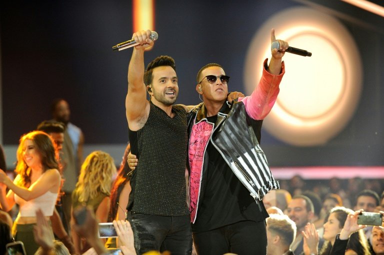 luis fonsi and daddy yankee perform onstage at the billboard latin music awards in april 2017 photo afp