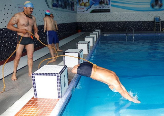 malik mohammad 24 jumps in a swimming pool during his training in kabul afghanistan photo reuters malik mohammad 24 jumps in a swimming pool during his training in kabul afghanistan photo reuters