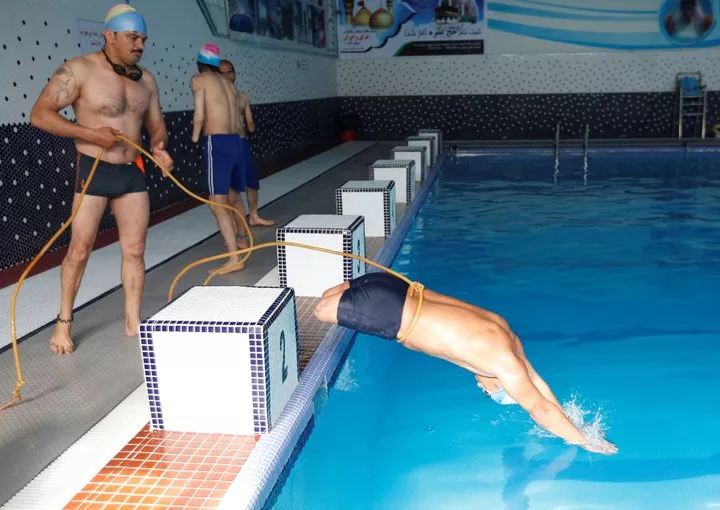 malik mohammad 24 jumps in a swimming pool during his training in kabul afghanistan photo reuters malik mohammad 24 jumps in a swimming pool during his training in kabul afghanistan photo reuters