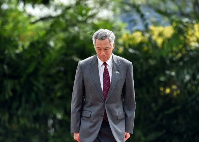 singapore prime minister lee hsien loong stands at an event at the istana presidential palace in singapore photo afp singapore prime minister lee hsien loong stands at an event at the istana presidential palace in singapore photo afp