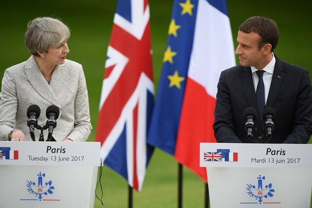 britain 039 s prime minister theresa may l and france 039 s president emmanuel macron hold a joint press conference in the grounds of the elysee palace in paris on june 13 2017 photo afp