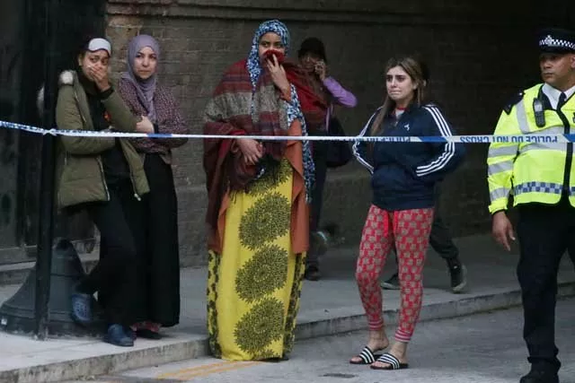 local residents watch as grenfell tower is engulfed by fire on june 14 2017 in west london the massive fire ripped through the 27 storey apartment block in west london in the early hours of wednesday trapping residents inside as 200 firefighters battled the blaze police and fire services attempted to evacuate the concrete block and said quot a number of people are being treated for a range of injuries quot including at least two for smoke inhalation photo afp local residents watch as grenfell tower is engulfed by fire on june 14 2017 in west london the massive fire ripped through the 27 storey apartment block in west london in the early hours of wednesday trapping residents inside as 200 firefighters battled the blaze police and fire services attempted to evacuate the concrete block and said quot a number of people are being treated for a range of injuries quot including at least two for smoke inhalation photo afp