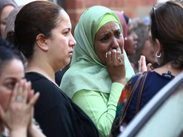 people react near a tower block severely damaged by a serious fire in north kensington west london britain june 14 2017 photo reuters people react near a tower block severely damaged by a serious fire in north kensington west london britain june 14 2017 photo reuters
