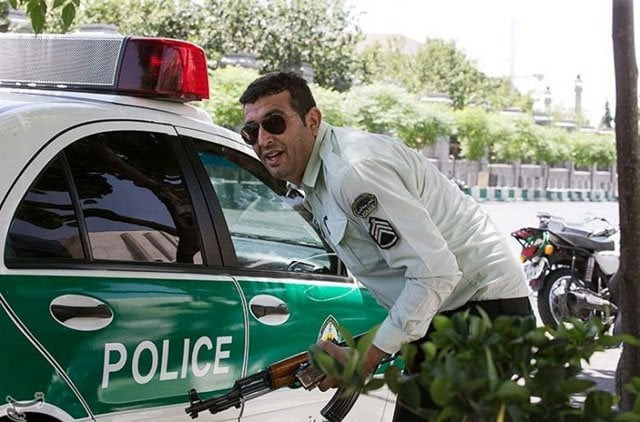 an iranian policeman takes cover during an attack on the iranian parliament in central tehran photo reuters an iranian policeman takes cover during an attack on the iranian parliament in central tehran photo reuters