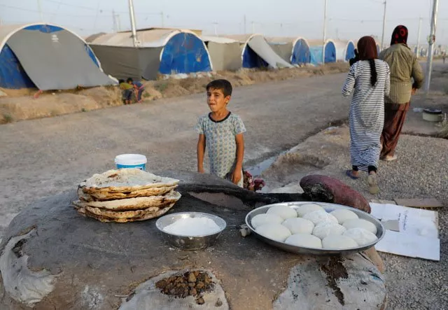 displaced iraqi family from mosul bake bread for their iftar during the muslim holy month of ramadan at a refugee camp al khazir in the outskirts of erbil iraq june 10 2017 photo reuters displaced iraqi family from mosul bake bread for their iftar during the muslim holy month of ramadan at a refugee camp al khazir in the outskirts of erbil iraq june 10 2017 photo reuters