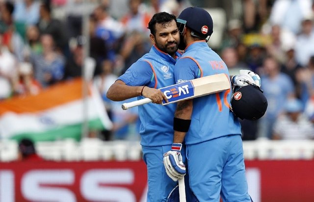 india 039 s captain virat kohli right congratulates rohit sharma on reaching 100 during the icc champions trophy semi final cricket match between india and bangladesh at edgbaston in birmingham on june 15 2017 photo afp