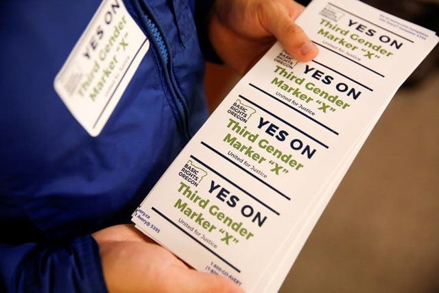 an employee of the advocacy group basic rights oregon hands out stickers during an oregon driver and motor vehicle department public hearing on the rights of transgender people as the state considers adding a third gender choice to driver 039 s licenses and identification cards in portland oregon may 10 2017 photo reuters an employee of the advocacy group basic rights oregon hands out stickers during an oregon driver and motor vehicle department public hearing on the rights of transgender people as the state considers adding a third gender choice to driver 039 s licenses and identification cards in portland oregon may 10 2017 photo reuters