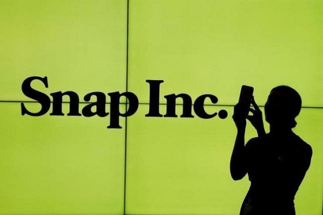 file photo a woman stands in front of the logo of snap inc on the floor of the new york stock exchange nyse while waiting for snap inc to post their ipo in new york city new york u s on march 2 2017 photo reuters file photo a woman stands in front of the logo of snap inc on the floor of the new york stock exchange nyse while waiting for snap inc to post their ipo in new york city new york u s on march 2 2017 photo reuters