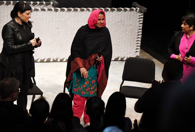 pakistani human rights activist mukhtar mai c receives a standing ovation as she takes the stage following a performance of the opera thumbprint at the roy and edna disney calarts theater in los angeles california june 16 2017 photo afp
