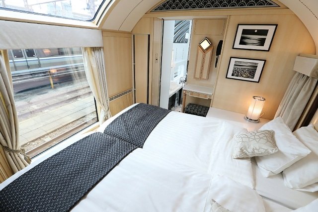 this picture shows a suite of japan 039 s latest super deluxe cruise train quot twilight express mizukaze quot during its press preview in osaka japan 039 s latest super deluxe train left the station on june 17 in a chugging nod to art deco opulence that proves some people are willing to pay top yen to ride the rails the twilight express mizukaze departed osaka in its maiden trip with around 30 well heeled passengers on a journey to the far reaches of japan 039 s main island photo afp