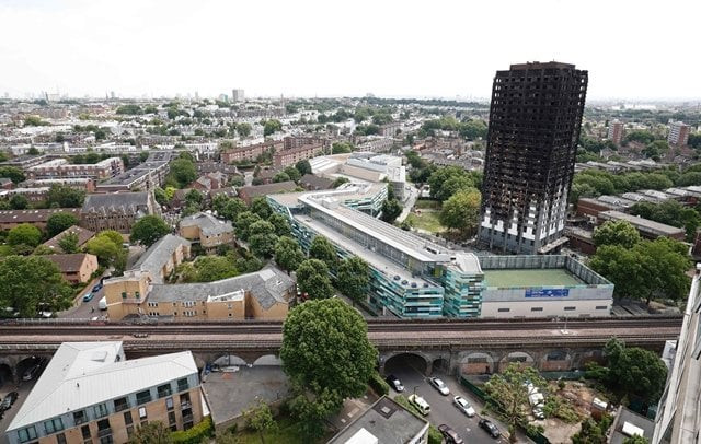 railway tracks run in front of the charred remains of the grenfell tower block in kensington west london on june 17 following the june 14 fire at the residential building photo afp railway tracks run in front of the charred remains of the grenfell tower block in kensington west london on june 17 following the june 14 fire at the residential building photo afp