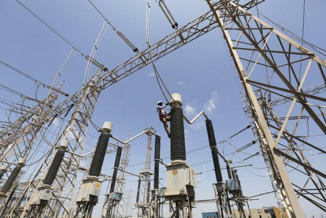 a technician repairs power supply lines at a power plant photo reuters a technician repairs power supply lines at a power plant photo reuters