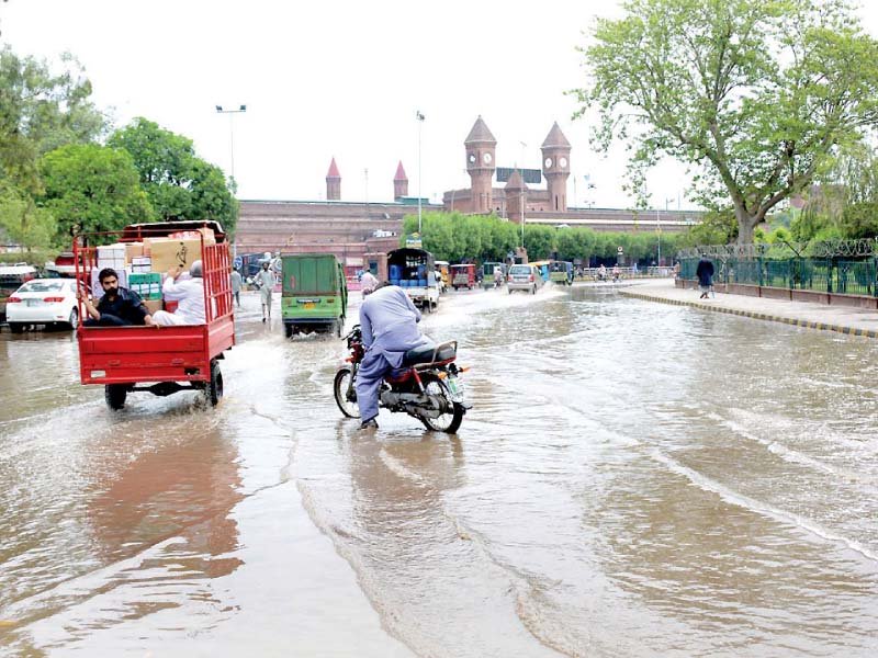 locals face difficulty while travelling through stagnant rainwater photo online