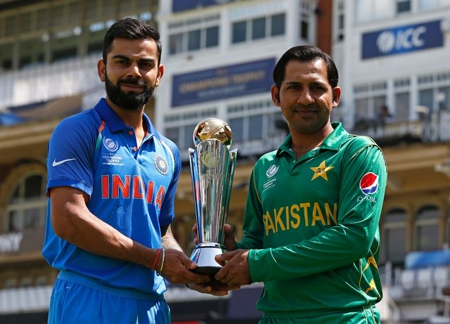 india 039 s captain virat kohli and pakistan 039 s captain sarfraz ahmed hold the trophy as they pose for a photgraph at the oval in london photo afp