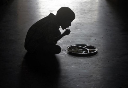 a boy eats at an orphanage photo reuters
