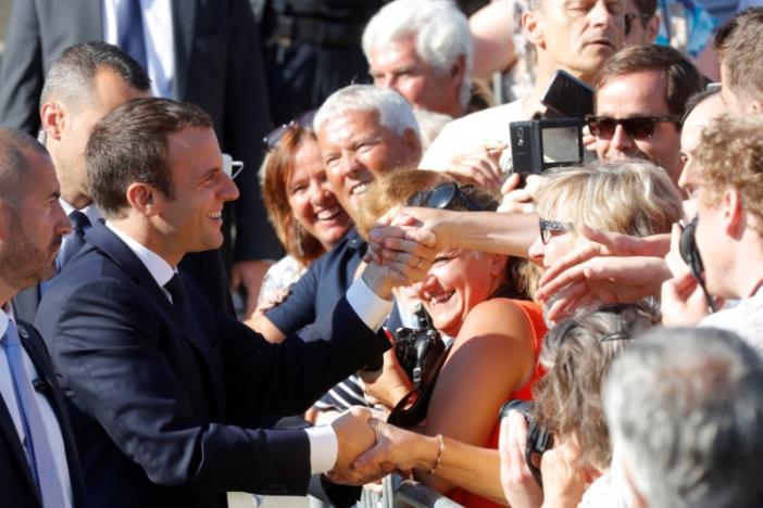 french president emmanuel macron shakes hands with supporters as he leaves city hall after casting his ballot in the second round of the parliamentary election in le touquet france june 18 2017 photo reuters