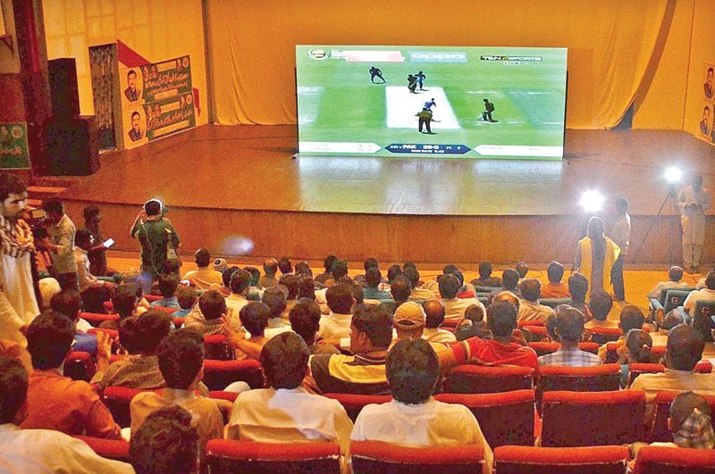 people watching the final of champions trophy at arts council multan photo app