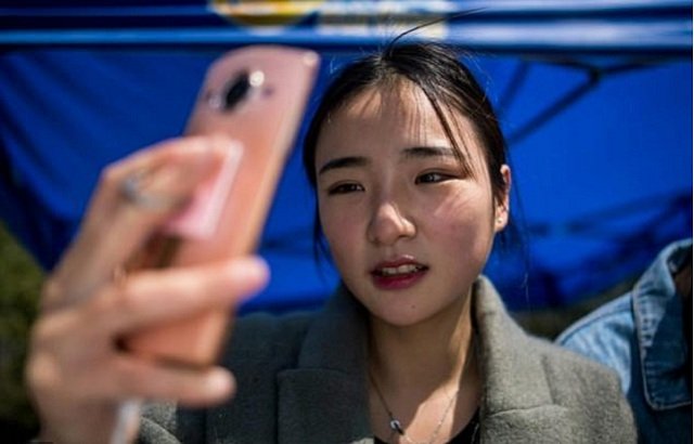 jiang mengna is majoring in quot modelling and etiquette quot at yiwu industrial amp commercial college near shanghai aspiring to join the growing ranks of young chinese cashing in on internet stardom photo afp