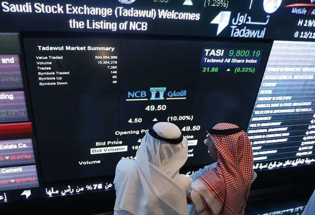 saudi investors monitor stocks in riyadh photo afp saudi investors monitor stocks in riyadh photo afp