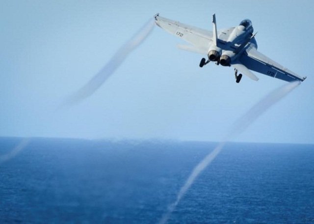 an f a 18e super hornet takes off from the flight deck of a u s navy aircraft carrier photo reuters