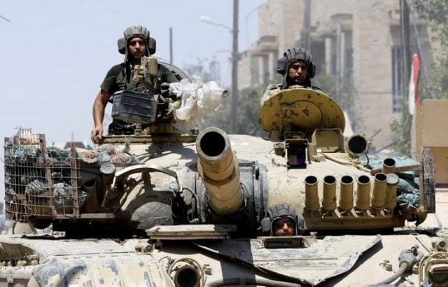 iraqi soldiers look out from a tank as they advances towards the islamic state militants positions in the old city in western mosul iraq june 18 2017 photo reuters