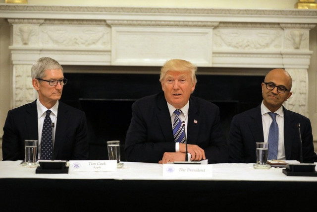 u s president donald trump participates in an american technology council roundtable accompanied by tim cook ceo of apple l and satya nadella ceo of microsoft corporation photo reuters u s president donald trump participates in an american technology council roundtable accompanied by tim cook ceo of apple l and satya nadella ceo of microsoft corporation photo reuters