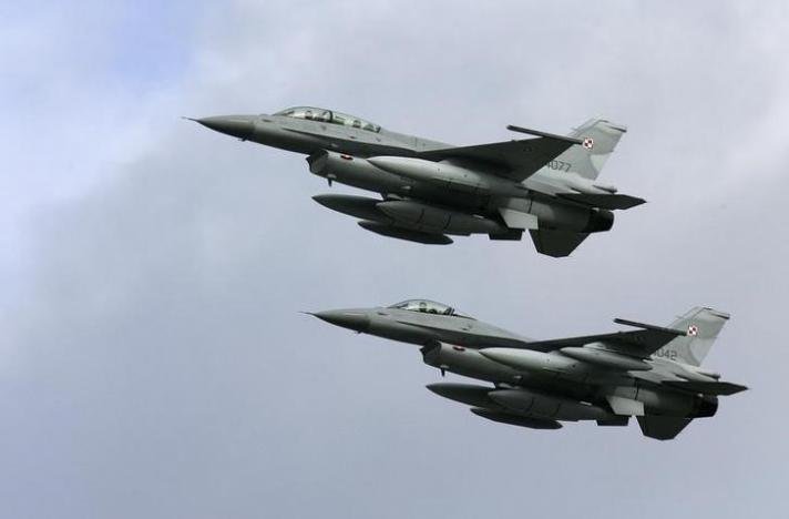 two f 16 fighter jets are pictured flying photo reuters