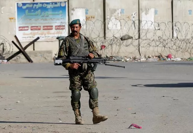 an afghan national army ana soldier keeps watch outside the bagram airfield entrance gate photo reuters an afghan national army ana soldier keeps watch outside the bagram airfield entrance gate photo reuters
